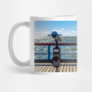 Sightseeing binoculars with sea background Mug